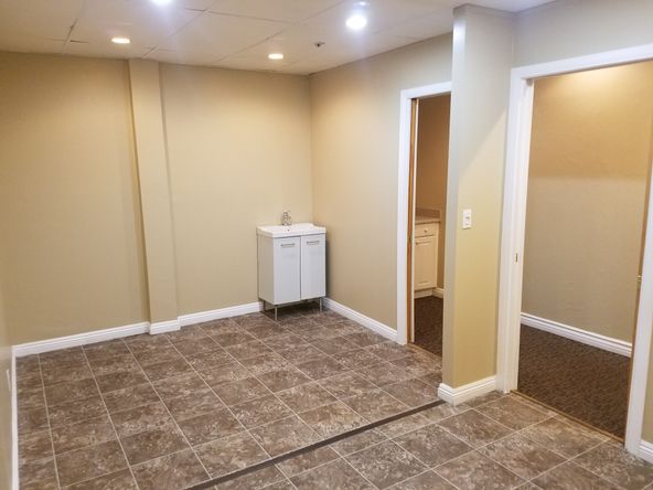 Ground floor office with beautiful tile entry and reception. Several uses.